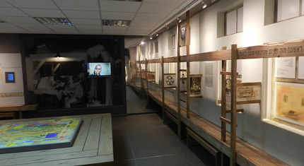 The exhibition “Children of Theresienstadt” - on the wall are wooden planks simulating bunks