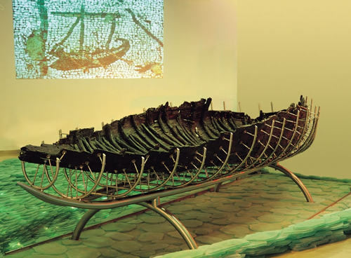 The ancient boat from Ginosar in its special exhibition hall at the museum