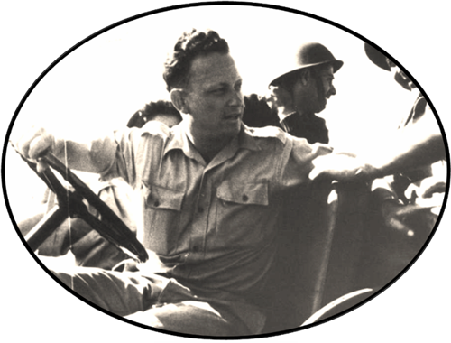 Yigal Allon sitting in a Jeep behind the wheel, with soldiers in the back