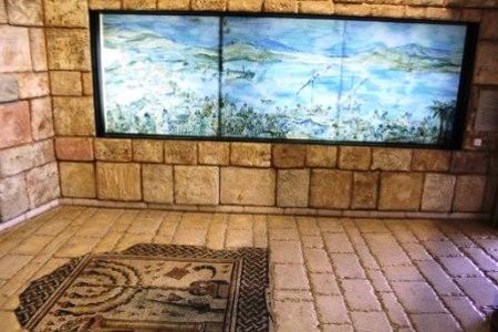 The Mishna and Talmud exhibition hall with an ancient mosaic of a Menorah on the floor