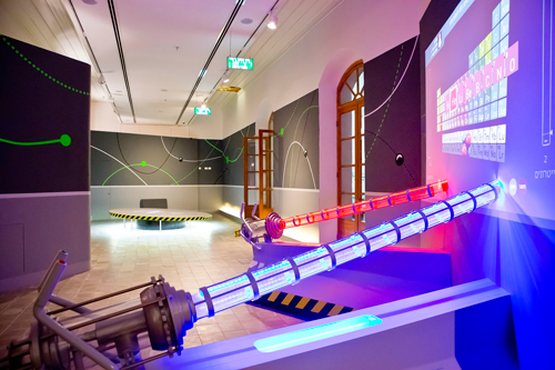 An exhibit made of illuminated pipes and the Table of Elements, in the exhibition about Atomic Structure