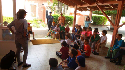 School students listen to a museum instructor